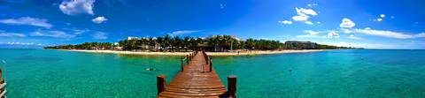 Wooden pier over clear water in Mexico