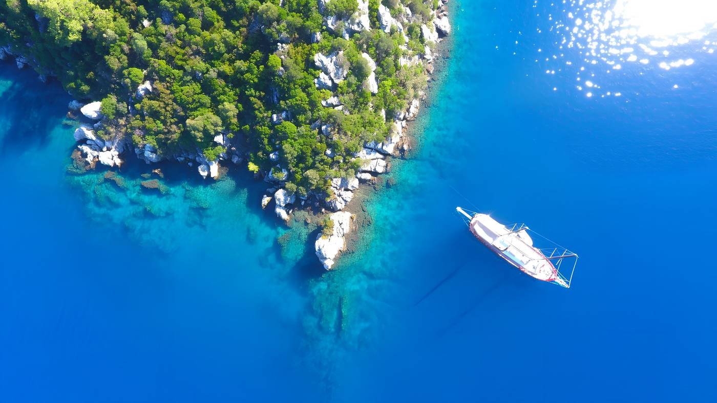 Sailing yacht in clear blue water off the coast of Marmaris, Turkey